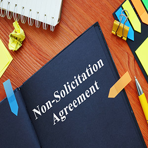 Illinois Non-Solicitation Law: Non-solicitation agreement on a desk for Illinois business law.
